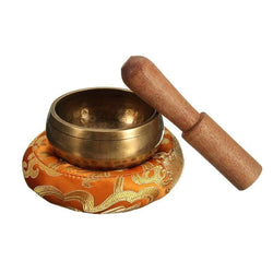 Tibetan bowl with wooden mallet and hand-sewn carpet